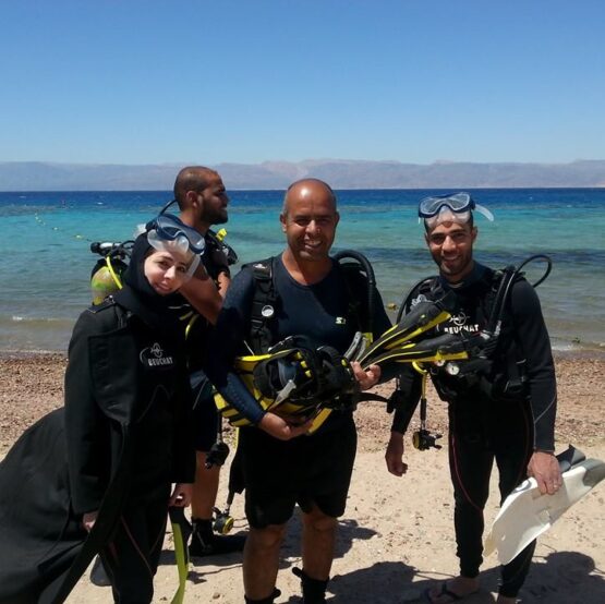 Divers with full equipment at the Mermaid Diving Center, South Beach